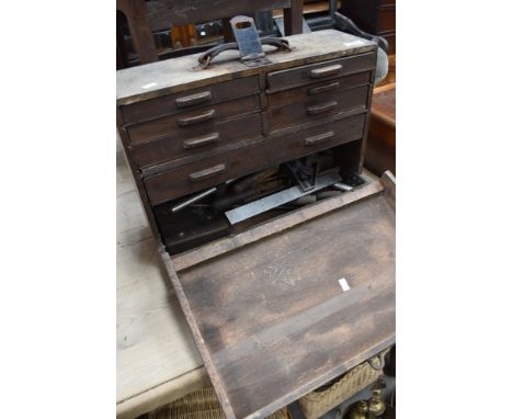 A early 20th century engineers tool chest, containing various tools, punches, calipers etc.
