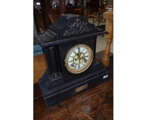 A Victorian black slate mantel clock, manufactured by The Ansonia clock company