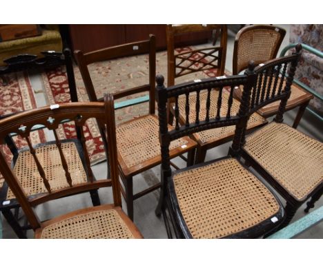 A group of seven 19th century and later cane seated bedroom chairs, including two bobbin turned examples