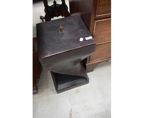 A modernist style wooden lamp base with carved twist