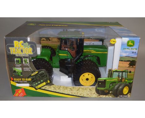 John Deere diecast remote control tractor full functional 9.6v by Ertl approximately 1:12 scale, model is boxed (1)