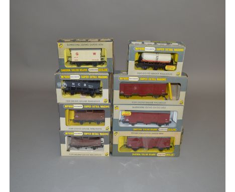 OO Gauge. 8 boxed Wrenn Wagons including W4305P Fruit Van 'Babycham', W5013 6 Wheeled Wagon 'St. Ivel' and W5035 Hopper Wagon