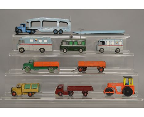 9 unboxed Dinky Toys diecast models, with varying degrees of play wear, including 582 Car Transporter with 793 Ramp, 30W Hind