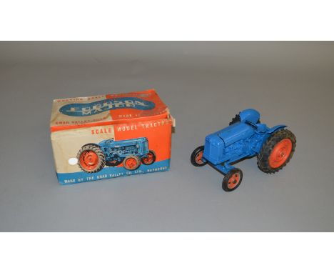 A boxed Chad Valley 'New Fordson Major' Tractor in royal blue with orange hubs. Overall appears G+ in generally G, complete b