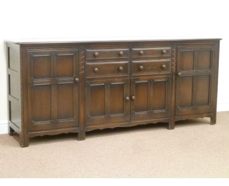 Ercol large medium elm dresser fitted with four drawers and two cupboards, W215cm, H91cm, D53cm