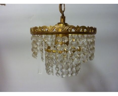 Five branch centre light fitting with cut crystal drops, two circlet light fittings with cut crystal drops and one other ligh