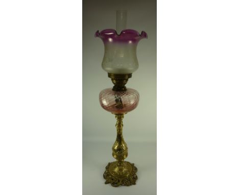 Victorian oil lamp with cranberry glass reservoir and amethyst tinted shade H78cm 