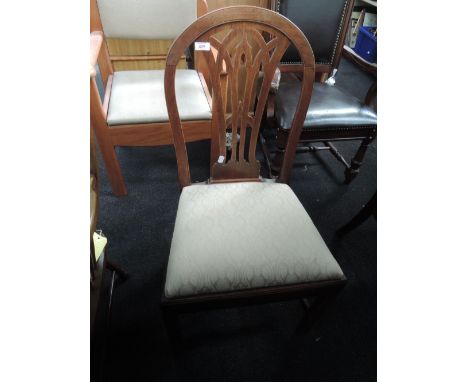 An early 19th century vernacular elm dining chair having arch slat back with later upholstered seat on square legs