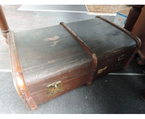 A vintage wood bound travel trunk