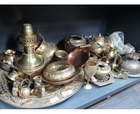 A selection of brassware, including an oil lamp and constant flame candle lamp