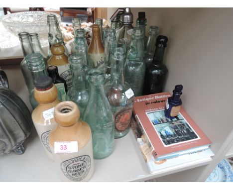 A selection of vintage glass and stoneware bottles including T Swainson and Son, Windermere and soda syphon from the same com