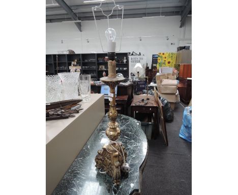 A gilt effect table lamp