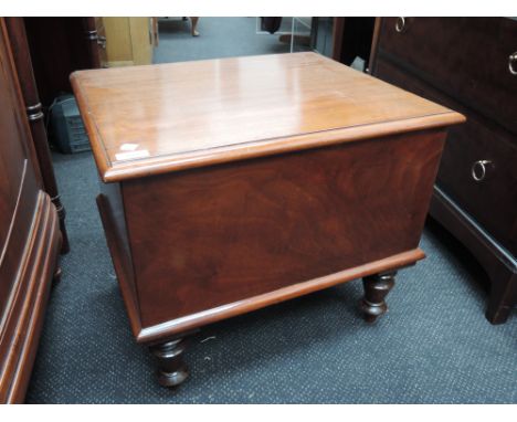 A Victorian mahogany commode having fitted pot and turned legs