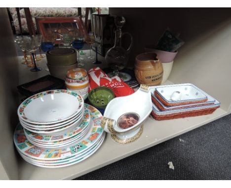 A shelf of various tableware etc