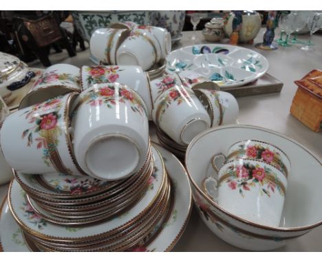 A part tea service gilted band with floral design