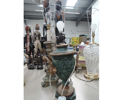 Two decorative table lamps one in the form of an urn and the other a resin candlestick