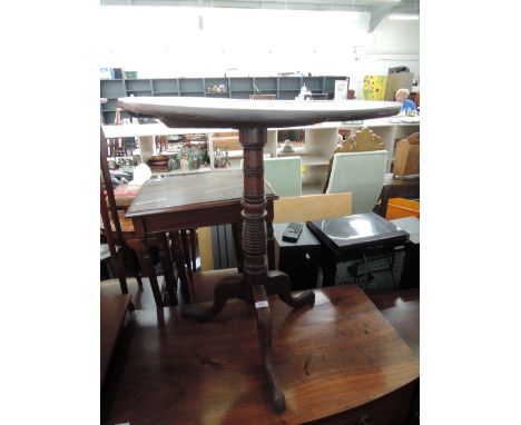 A 19th century mahogany pedestal table having circular top on ring turned column and triple splay feet