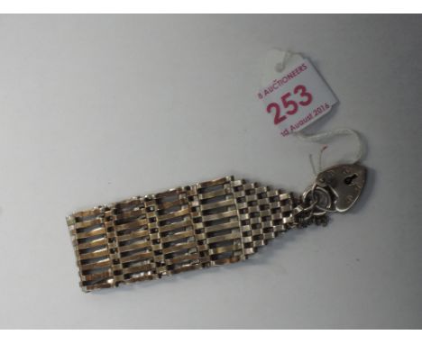 An eight bar HM silver gate bracelet with ring clasp and padlock stamped silver