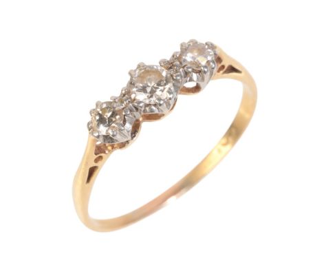 AN 18CT GOLD DIAMOND THREE STONE RINGset with three round brilliant cut diamonds, c.0.20 carats total, set in a platinum moun