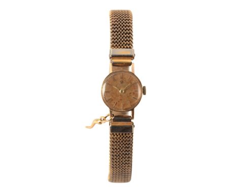 OMEGA: A LADY'S 9CT GOLD WRISTWATCHwith manual wind movement, the gold dial with gold baton numerals and hands, the case back