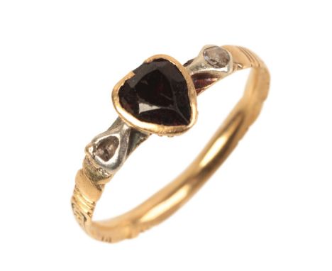 AN GARNET AND DIAMOND POSY RINGpossibly mid-18th century, in a gold coloured metal setting, with pear shaped garnet and a sin