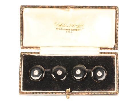 A PAIR OF CARTIER BLACK AND GOLD CUFFLINKSeach cufflink set with two antique cut diamonds measuring approx. 3.5mm, stamped 'C