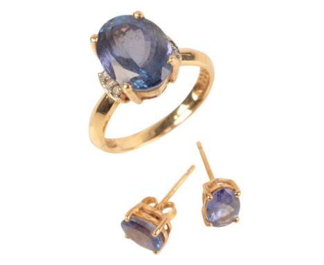 AN 18CT GOLD IOLITE AND DIAMOND RINGset with a central oval cut iolite measuring approx. 10.22mm x 7.63mm, ring size M; toget