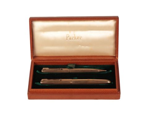 PARKER: A 9CT GOLD CASED PEN AND PENCIL SETthe engine turned cases and vacant rectangular cartouches, comprising fountain pen