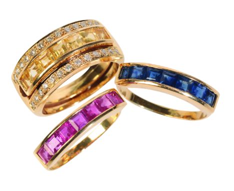 A GOLD DIAMOND RING WITH INTERCHANGEABLE INSERTSwith yellow, blue, and pink sapphire gemstone inserts, each set with seven sa