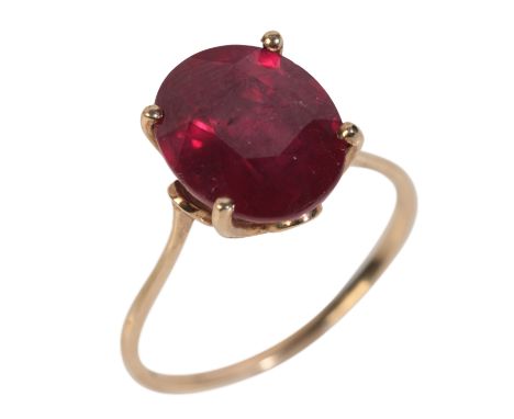 A 9CT GOLD GLASS FILLED RUBY RING&nbsp;the deep red ruby measuring approx. 11.77mm x 9.66mm x 7.75mm in a buttercup setting, 