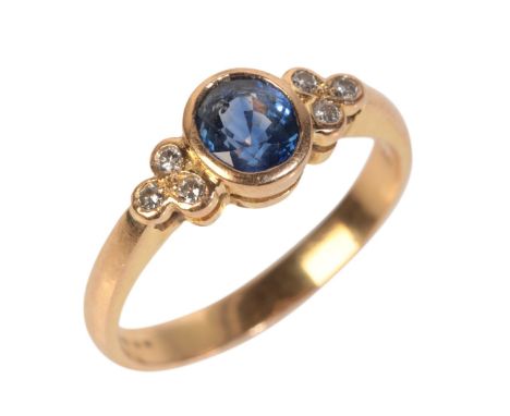 AN 18CT GOLD SAPPHIRE AND DIAMOND RINGthe oval cut sapphire c.0.71 carats, with diamond shoulders c.0.20 carats total weight,