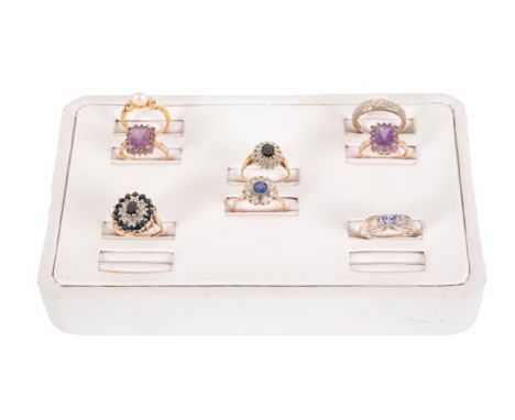 A 9CT GOLD SAPPHIRE AND DIAMOND RING ALONG WITH A FURTHER SEVEN GEMSTONE RINGS&nbsp;the cluster ring set with central sapphir