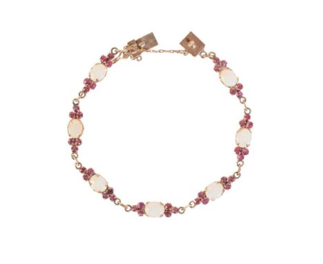 AN 18CT GOLD OPAL AND RUBY BRACELETthe seven opals and forty two rubies set in panels, stamped '18K' (c.11.28g gross weight)