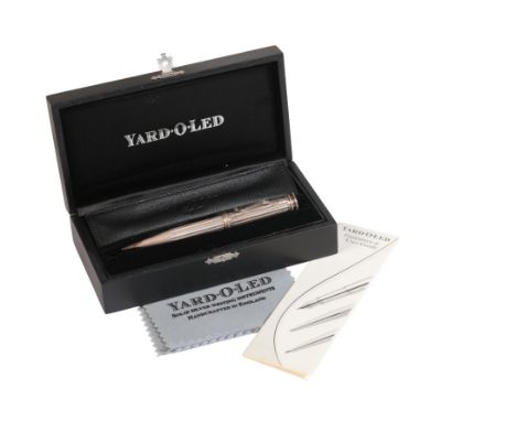 YARD-O-LED: A SILVER PROPELLING PENCILwith lead refills and leather case, in the original box with leaflet