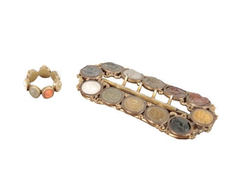 A 19TH CENTURY GRAND TOUR SPECIMEN LAVA AND CORAL CAMEO RINGthe ring set with seven portrait cameos of Roman deities and char