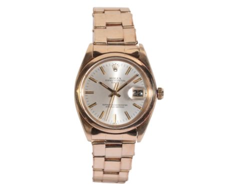 ROLEX OYSTER PERPETUAL "DATE": A GENTLEMAN'S 14CT GOLD BRACELET WATCH with manual wind movement, the silver dial with gold ba