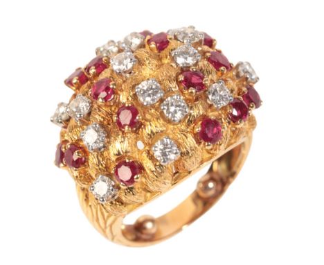AN 18CT GOLD 1970S BRUTALIST DIAMOND AND RUBY BOMBE RINGretailed by J.E Caldwell, the ring with a bark patterned shank and te
