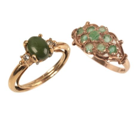 AN EMERALD RINGset in 9ct gold, comprising nine small emeralds forming a posy shape, hallmarked '375', ring size P (c.2.22g w