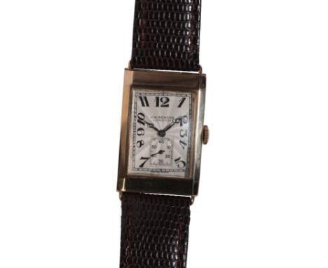 J.W.BENSON, LONDON: A GENTLEMAN'S 9CT GOLD WRISTWATCHwith manual wind movement, the silver sunburst dial with subsidiary seco