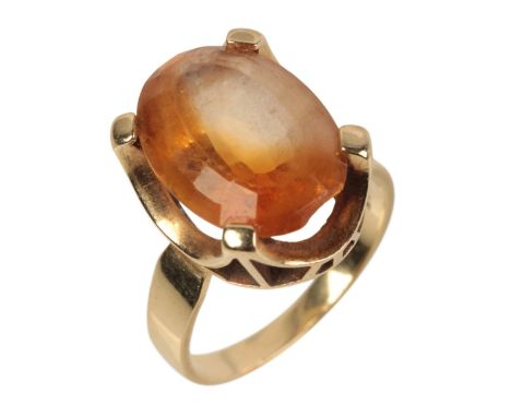 A 14CT GOLD CITRINE RINGset with an oval cut citrine, held in a stylised claw setting, ring size M 1/2, stamped '585' (c.5.62