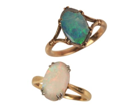 AN 18CT GOLD AND PLATINUM OPAL RINGset with an opal, held in platinum claws to an 18ct yellow gold shank, ring size J 1/2 (c.