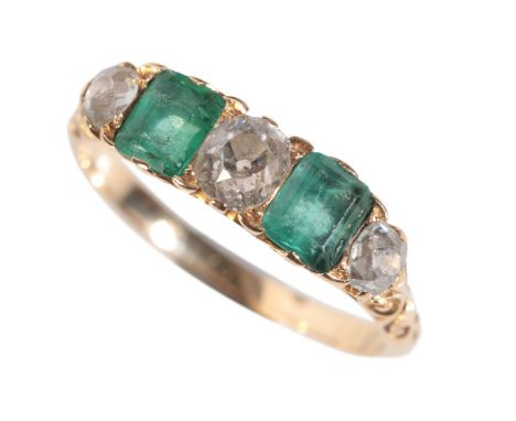 A VICTORIAN 18CT GOLD EMERALD AND DIAMOND RINGset with two step cut emeralds interspersed by old mine cut diamonds, ring size