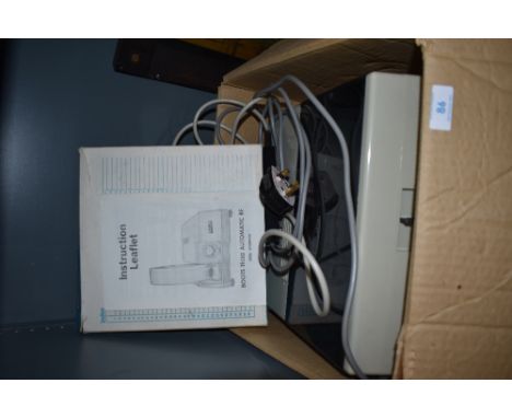 A Boots projector and a Gnome Rotary slide magazine.