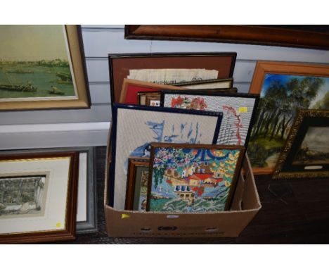 A box of needle works, prints and original art works.