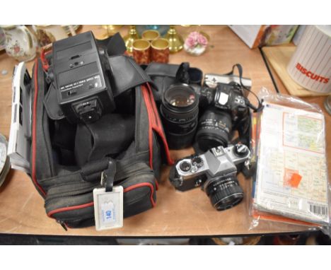 A collection of cameras and accessories including Pentax KX, Minolta,Sigma AP0 macro 70/300mm lens and more, also included ar