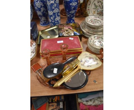 An art deco glass dressing table tray and candle sticks, a tin of costume jewellery, mirrors and brushes and similar.