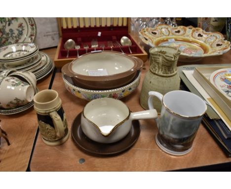 A selection of ceramics including Poole bowl Tremar style jug and train mug