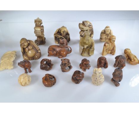A collection of wooden ojime beads, netsuke and other carvings in wood and bone, 21 in total 