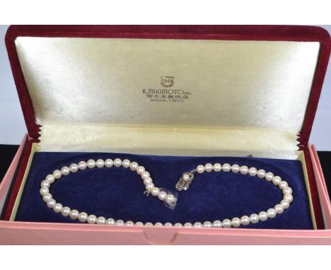 Mikimoto cultured pearl necklace with a silver clasp, clasp marked 'M' for Mikimoto, circumference 385mm, together with origi