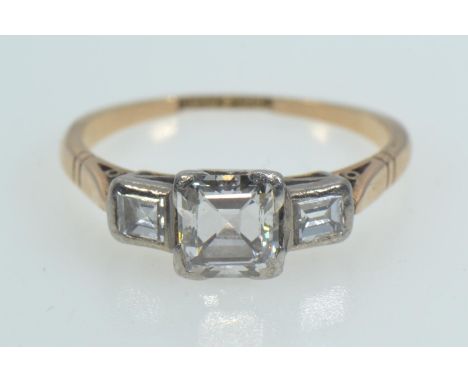 18ct gold, platinum & emerald-cut diamond trilogy ring, the centre stone weighing approximately 0.50 carat, size M1/2, 2.48 g